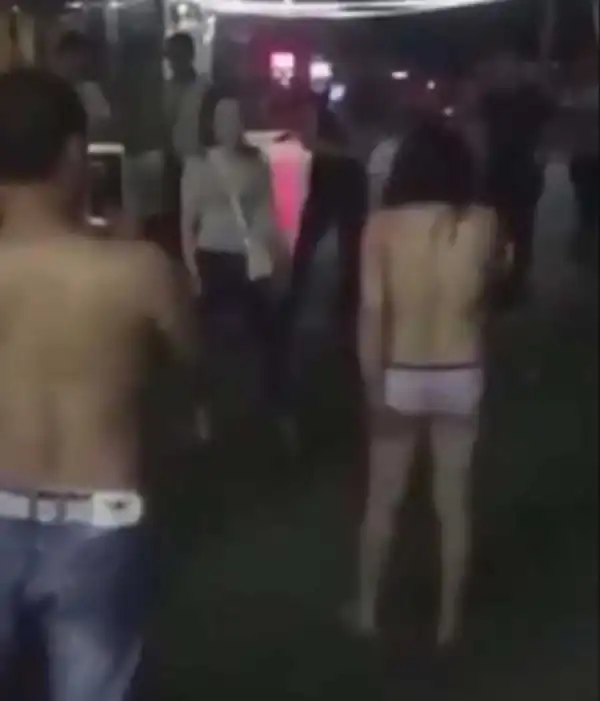 Oh No! Woman is Dragged Half-n*ked Into the Street After Being Caught Having S*x With Married Man (Photos)